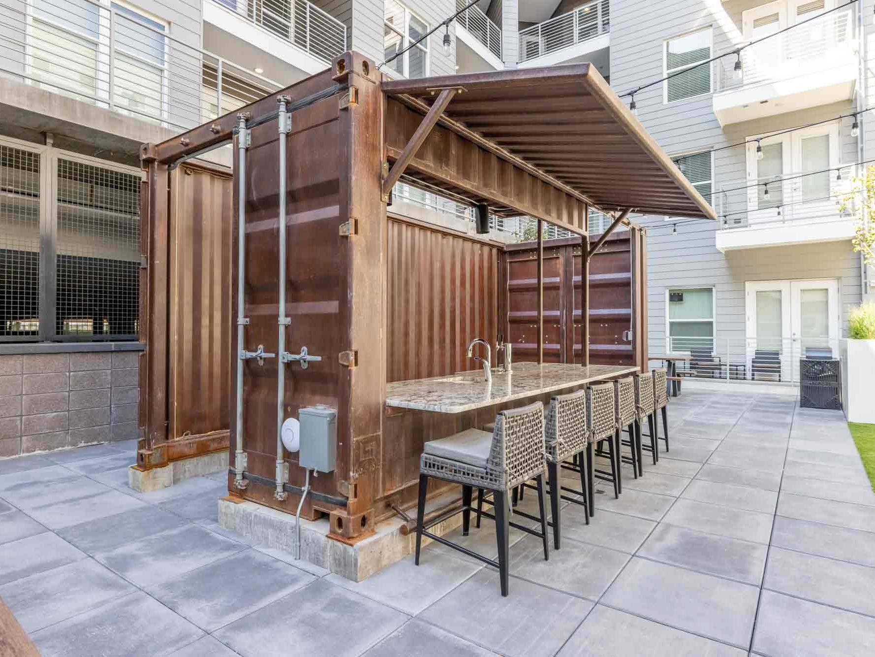 Price Development Group custom shipping container patio bar built by ROXBOX Containers.